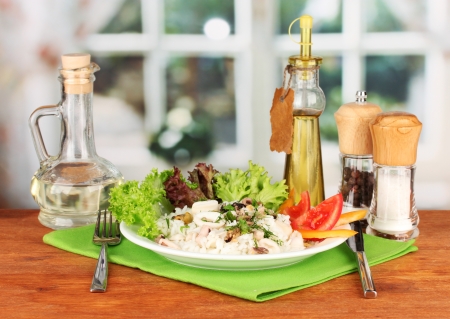 Delicatessen seafood salad with rice on bright backgroundの写真素材