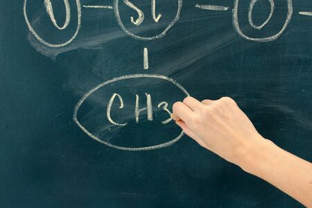 Chemical structure formula written on blackboard with chalk.