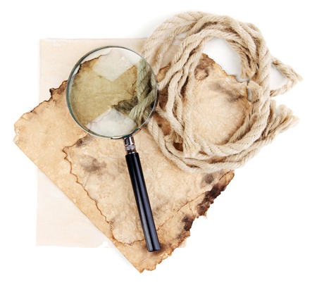 Old paper with magnifying glass and rope isolated on whiteの写真素材