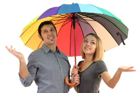 Loving couple with umbrella isolated on whiteの写真素材