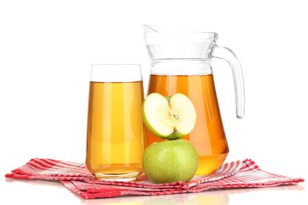 Full glass and jug of apple juice and apples isolted on whiteの写真素材