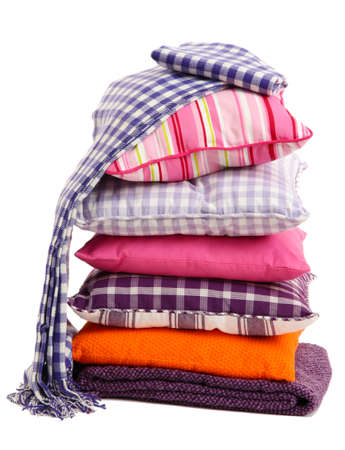 Hill colorful pillows and plaids isolated on white