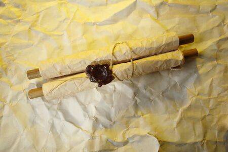 Old scroll, on brown paper backgroundの写真素材
