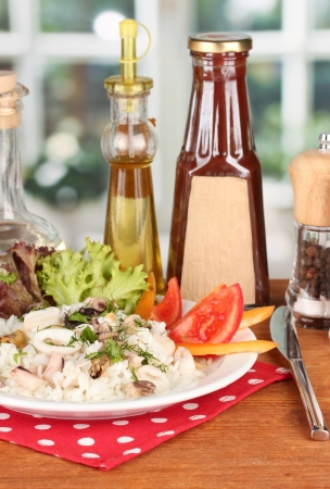 Delicatessen seafood salad with rice on bright backgroundの写真素材