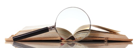 Magnifying glass and book isolated on whiteの写真素材
