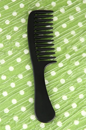 Black comb on color backgroundの写真素材