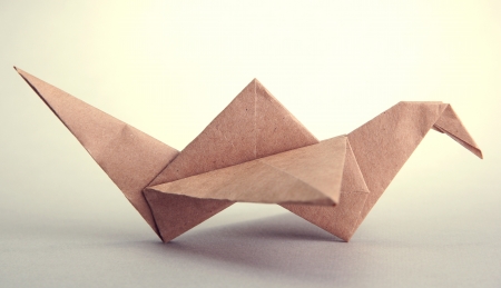 Origami crane on grey backgroundの写真素材