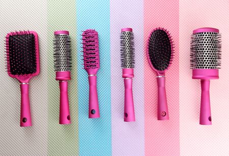 Comb brushes on bright backgroundの写真素材