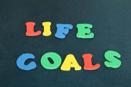Phrase LIFE GOALS in colorful letters on school board close-upの写真素材