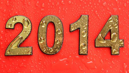 2014 in golden numbers, on red backgroundの写真素材