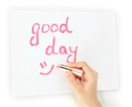 Inscription lipstick on white paper, isolated on whiteの写真素材