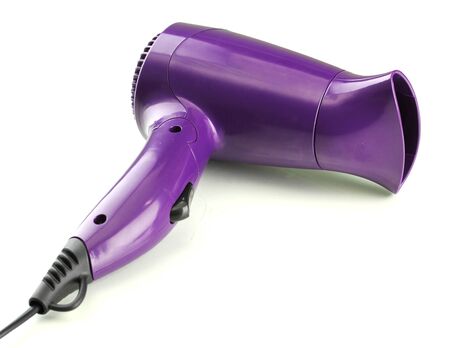 Hair dryer on purple backgroundの写真素材