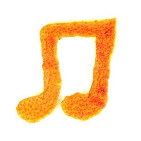 Decorative musical notes from dry orange peel isolated on whiteの写真素材