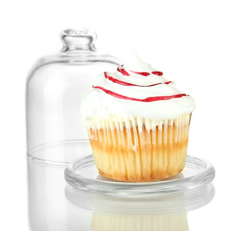 Cupcake on glass saucer, isolated on whiteの写真素材