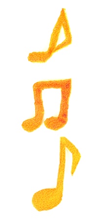 Decorative musical notes from dry orange peel isolated on whiteの写真素材