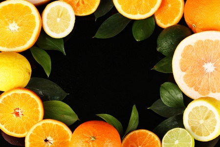 Lots ripe citrus isolated on blackの写真素材