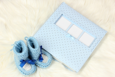 Baby photo album on white carpetの写真素材