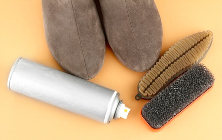 Set of stuff for cleaning and polish shoes, on color backgroundの写真素材