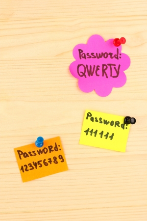 Stickers-reminders with most popular passwords, on wooden backgroundの写真素材