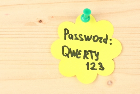Sticker-reminder with most popular password, on wooden backgroundの写真素材