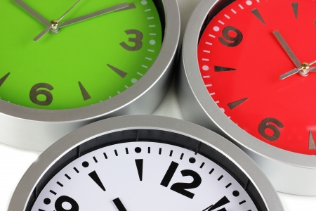 Round office clocks isolated on white