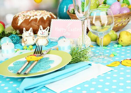 Serving Easter table on room background