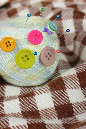 Ball of thread on checked plaidの写真素材