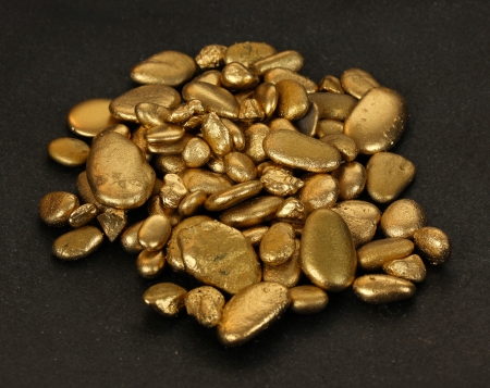 Golden stones on black background