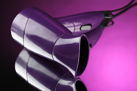 Hair dryer on purple backgroundの写真素材