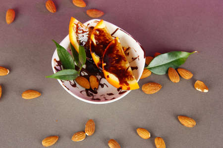 Fruit in chocolate against a gray backgroundの写真素材