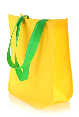 Yellow bag with green handles isolated on whitの写真素材