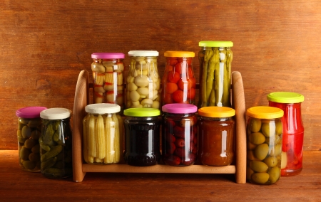 Different conservations on shelves on wooden backgroundの写真素材