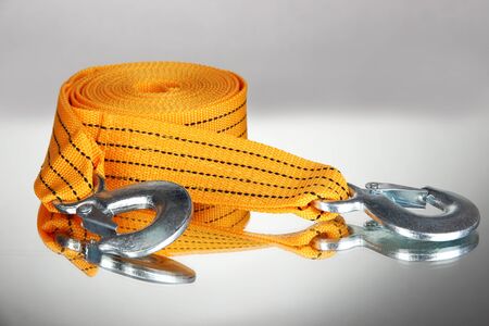 Tow rope for car on grey background