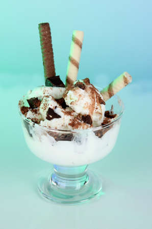 Ice cream with wafer sticks on blue background
