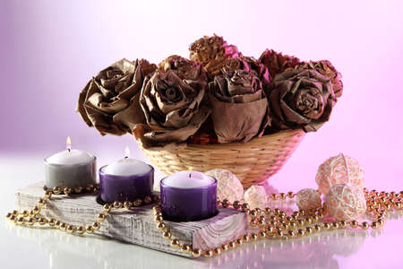 Still life with roses and candles on white  backgroundの写真素材