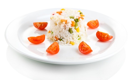 Delicious risotto with vegetables, isolated on whiteの写真素材