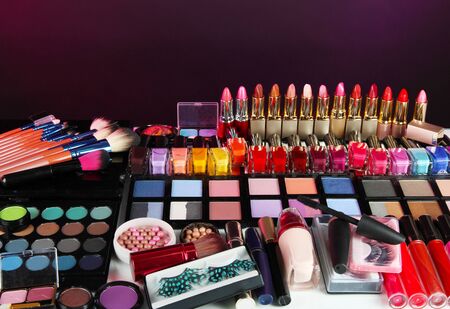 Lot of different cosmetics on purple backgroundの写真素材