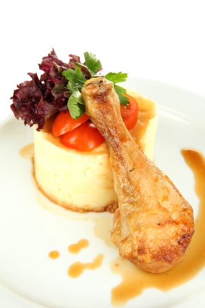 Small portion of food on big plate isolated on whiteの写真素材