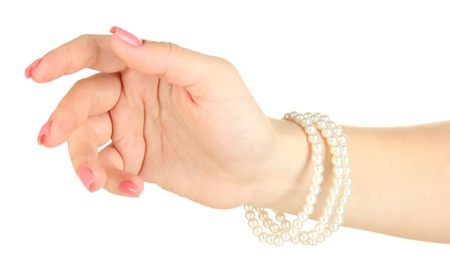 Female hand with pink manicure and bright bracelets, isolated on whiteの写真素材
