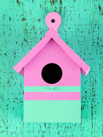 Decorative nesting box on color wooden backgroundの写真素材