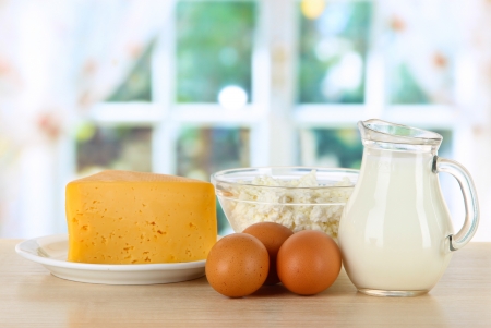 Dairy products and eggs on table in kitchenの写真素材