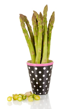 Fresh asparagus in colorful pot isolated on white
の写真素材