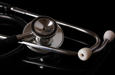Stethoscope close-up isolated on blackの写真素材