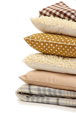 Hill colorful pillows and plaids isolated on whiteの写真素材