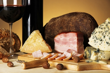 Exquisite still life of wine, cheese and meat productsの写真素材