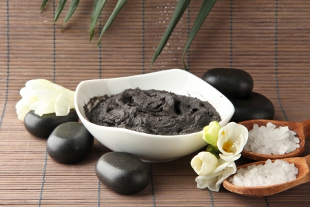 Composition with cosmetic clay for spa treatments, on bamboo backgroundの写真素材