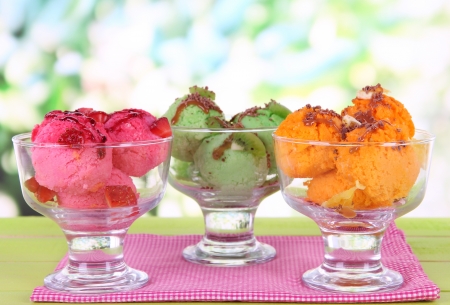 Delicious ice cream on table on bright backgroundの写真素材