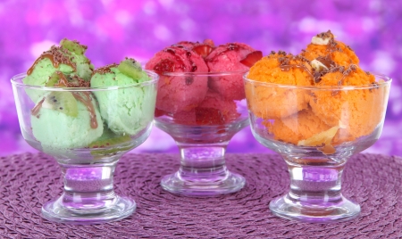 Delicious ice cream on table on bright backgroundの写真素材