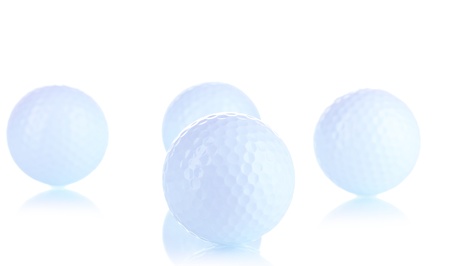 Golf balls isolated on whiteの写真素材