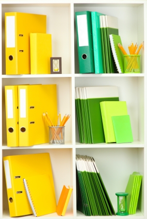 White office shelves with different stationery, close upの写真素材